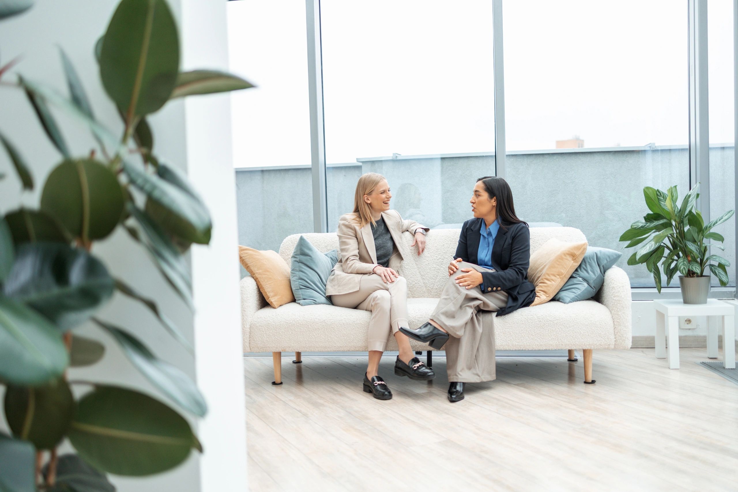 Financial consultants meeting with a client in a modern office