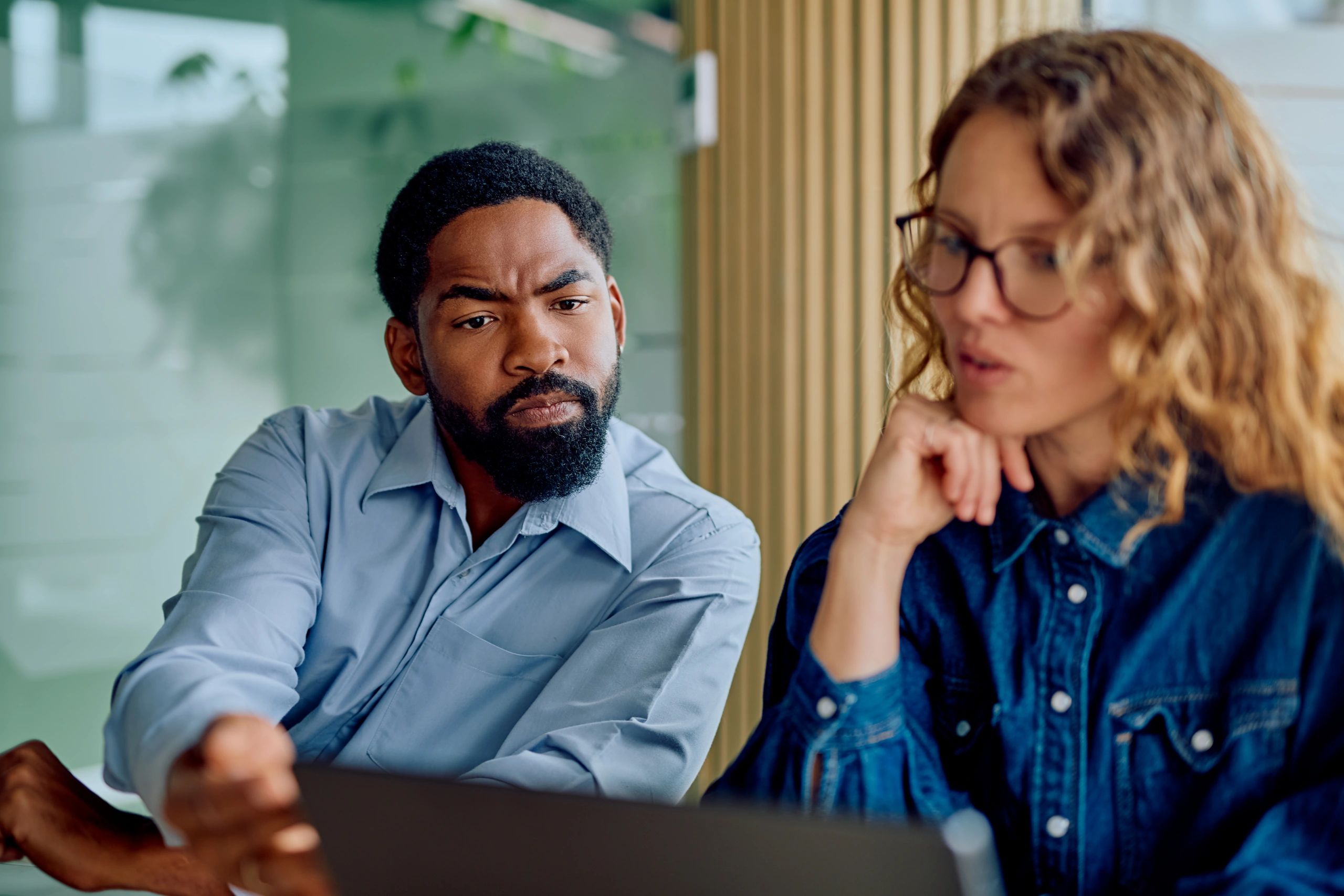 Two advisors collaborating on a financial planning strategy